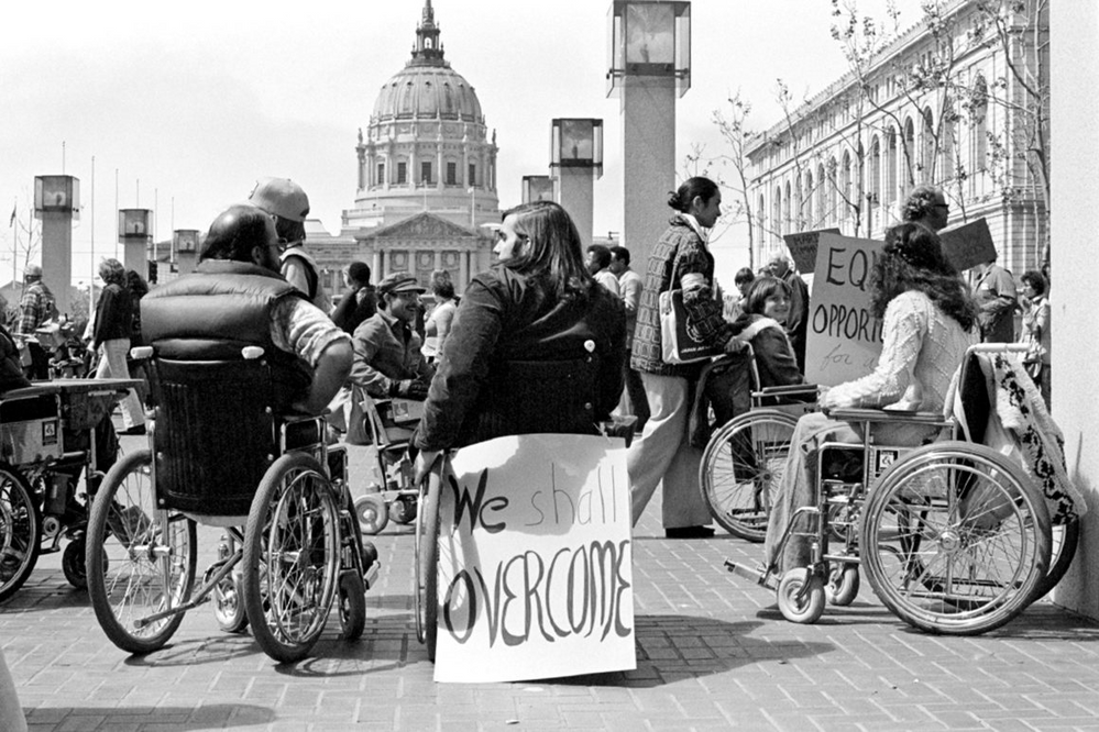 Protesters in wheelchairs outside a federal building in San Francisco. Photo credit: Anthony Tusler